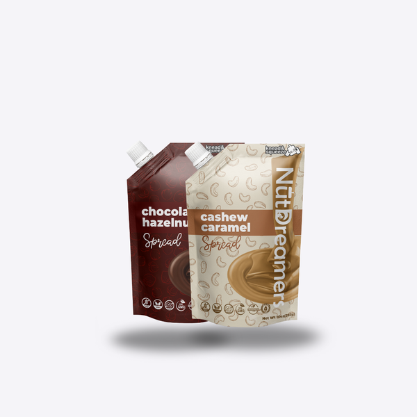 Two Nut Dreamers spreads one chocolate hazelnut and one cashew caramel, on a white background.